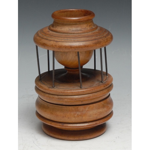 242 - Treen - a 19th century boxwood cotton reel stand, surmounted by a wool holder, compartment to base, ... 