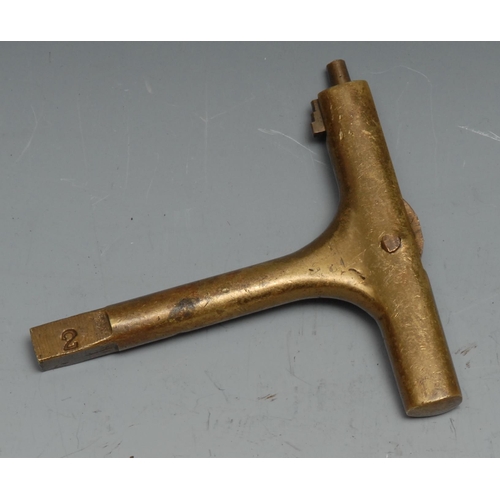 69 - Copoclephily - a 19th century brass carriage key, the T-shaped haft enclosing a further folding door... 