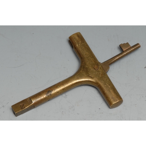 69 - Copoclephily - a 19th century brass carriage key, the T-shaped haft enclosing a further folding door... 