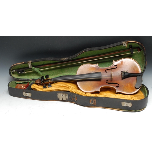 210 - A violin, the two-piece back 35.75cm long excluding button, paper label Straduarius Cremonensis Faci... 