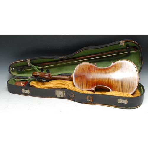 210 - A violin, the two-piece back 35.75cm long excluding button, paper label Straduarius Cremonensis Faci... 