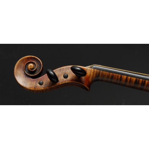 210 - A violin, the two-piece back 35.75cm long excluding button, paper label Straduarius Cremonensis Faci... 