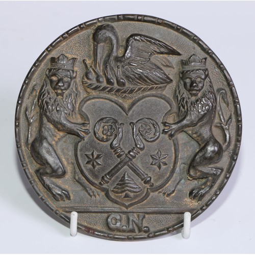 231 - Heraldry - a 19th century bronze armorial boss, cast in relief with a coat of arms comprising crosse... 