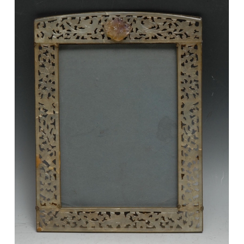 294 - A Chinese jade easel photograph frame, the border pierced and carved with birds amongst lotus and sc... 