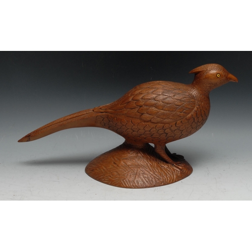 154 - Folk Art - a mahogany carving, of a game bird, 42cm long