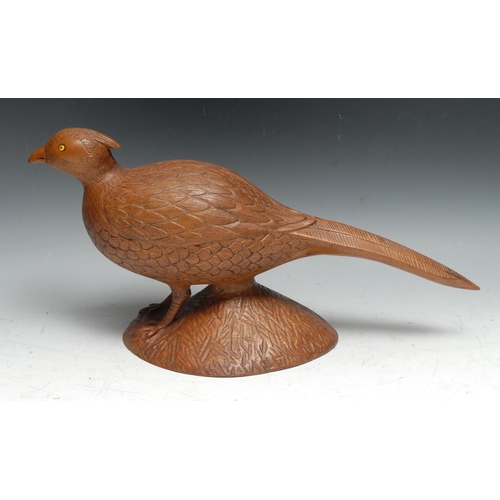 154 - Folk Art - a mahogany carving, of a game bird, 42cm long