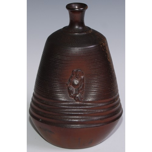 257 - A 19th century salt glazed trefoil bottle vase, the dimpled sides applied with Chinese figure, 24cm ... 