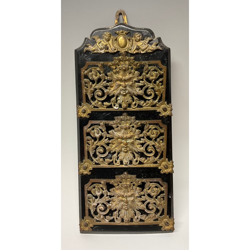 172 - A 19th century Renaissance Revival gilt brass and ebonised wall mounted correspondence rack, pierced... 