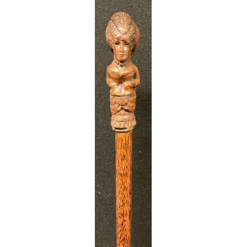 52 - A 19th century French walking cane,  the pommel carved as an aristocratic lady, palm wood shaft, 99c... 