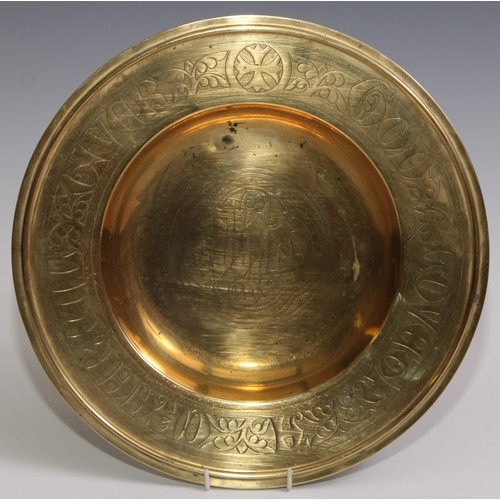 332 - A Gothic Revival brass alms dish, in the manner of Augustus Welby Northmore Pugin, chased and inscri... 