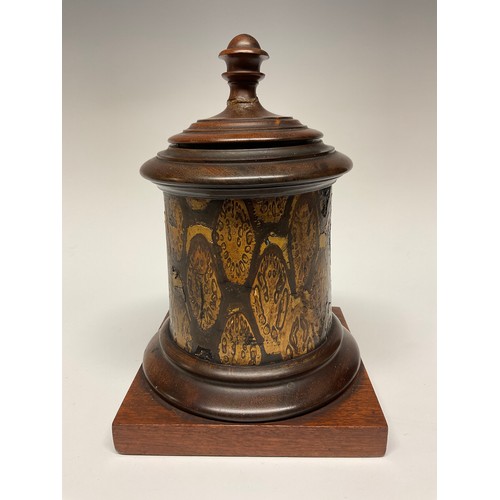 17 - A 19th century exotic timber and mahogany tobacco jar, turned cover and socle, square base, zinc lin... 