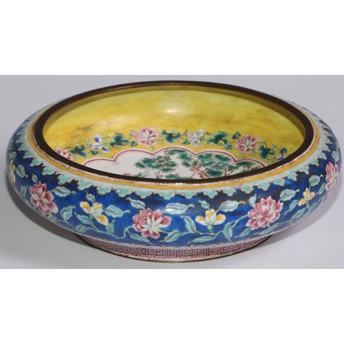 287 - A Chinese famille rose enamel bowed circular bowl, painted in the typical Cantonese manner with ladi... 