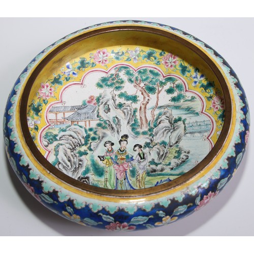 287 - A Chinese famille rose enamel bowed circular bowl, painted in the typical Cantonese manner with ladi... 