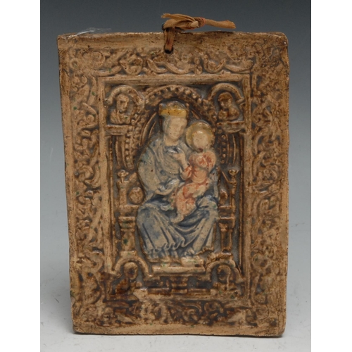 314 - A Continental majolica rectangular plaque, in relief with enthroned Madonna and Child, 14.5cm x 10.5... 