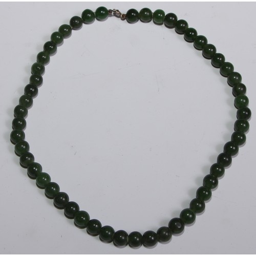 293 - A Chinese jade bead necklace, 40cm long