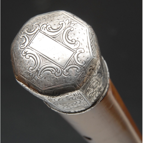 260 - A 19th century silver coloured metal mounted walking stick, the octagonal pommel engraved in the Roc... 