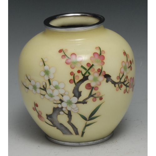 132 - A Japanese cloisonne vase, decorated in polychrome with blossoming prunus on a pale yellow ground, 1... 