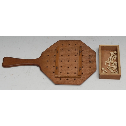 155 - Folk Art - a mahogany pan-handled solitaire board, the base with compartment enclosing bone pegs, 22... 