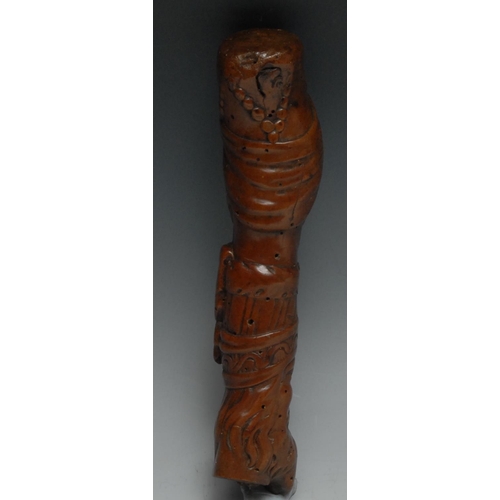 18 - A 19th century folk art walking stick handle, carved with Ottoman heads, 20cm long