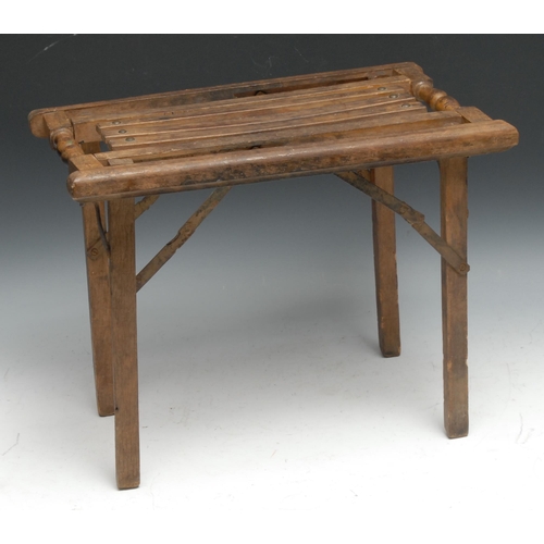 115 - A campaign type folding stool, 40cm wide, c.1900