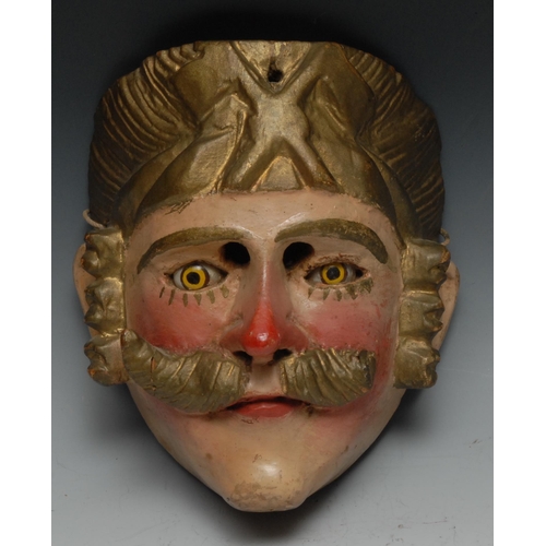 61 - A Central American folk art mask, carved as a moustached man, possibly Tecun Uman, painted in flesh ... 