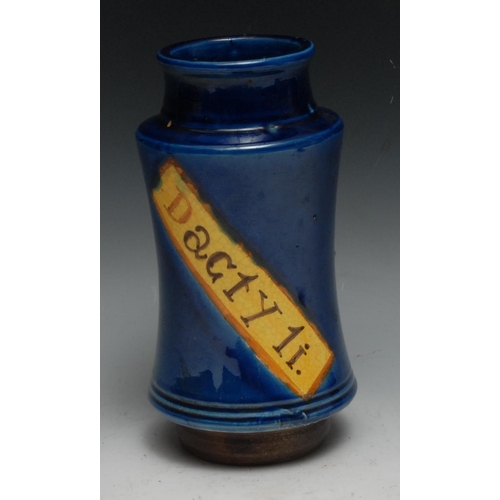 311 - A Continental albarello drug jar, inscribed Dacty Li, within a yellow banner on a blue glazed ground... 