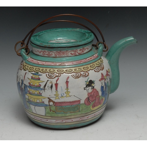 307 - A Chinese Yixing type wine pot, brightly decorated in polychrome enamels with figures, 21cm long