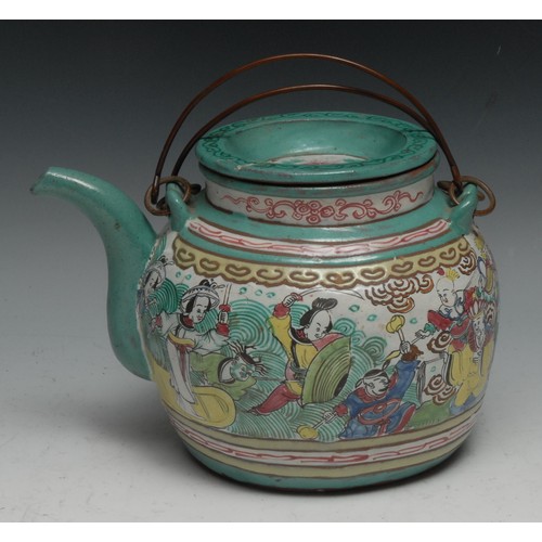 307 - A Chinese Yixing type wine pot, brightly decorated in polychrome enamels with figures, 21cm long