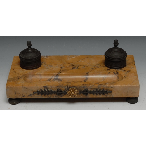 323 - A French Empire bronze and Sienna marble inkstand, cylindrical wells with hinged covers, 32cm wide, ... 