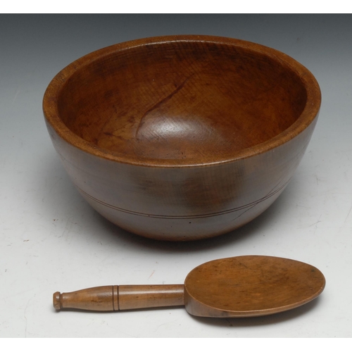 248 - Treen - a sycamore dairy bowl, 28cm diam; a butter spoon, 24.5cm long (2)