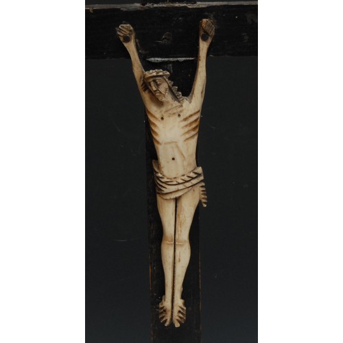 322 - A French bone corpus Christi, probably Napoleonic prisoner of war, ebonised cross, stepped base, 46.... 