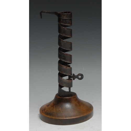 109 - A 19th century iron and softwood spiral candlestick, 19cm high