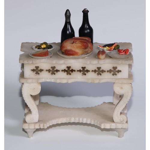 321 - A French alabaster table, carved and painted as a table laden with food, 13cm wide, c.1880