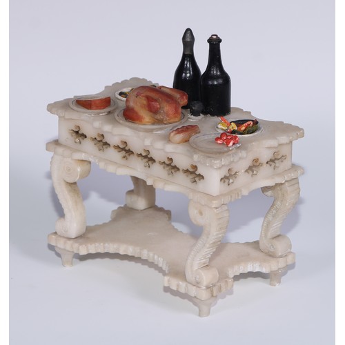 321 - A French alabaster table, carved and painted as a table laden with food, 13cm wide, c.1880