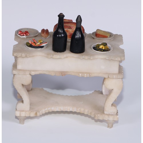 321 - A French alabaster table, carved and painted as a table laden with food, 13cm wide, c.1880