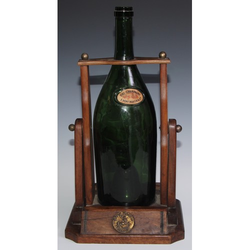 139 - A large French cognac pouring cradle, Remy Martin Cognac, holding a large green vacant bottle, Fine ... 