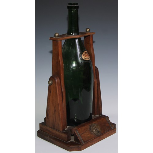 139 - A large French cognac pouring cradle, Remy Martin Cognac, holding a large green vacant bottle, Fine ... 