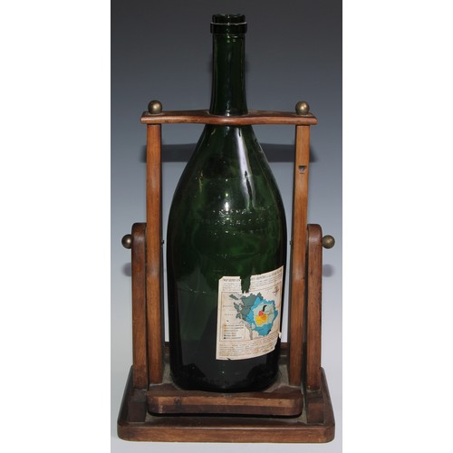 139 - A large French cognac pouring cradle, Remy Martin Cognac, holding a large green vacant bottle, Fine ... 