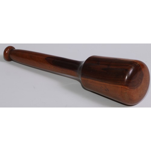 243 - Treen - a 19th century lignum vitae pestle, 27cm long; another pestle; a turned lignum vitae mortar,... 