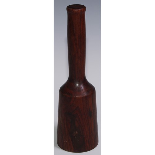 243 - Treen - a 19th century lignum vitae pestle, 27cm long; another pestle; a turned lignum vitae mortar,... 