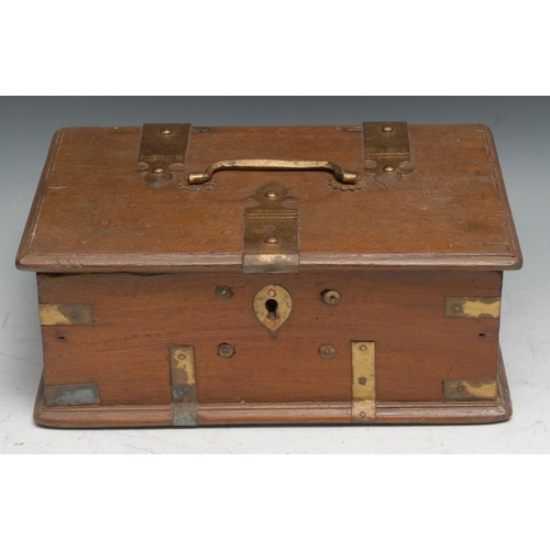 545 - An Indian brass bound hardwood rectangular box, hinged cover with swing handle, enclosing a pair of ... 