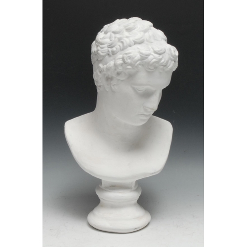 490 - After the antique, a plaster library bust, head of Apollo, waisted socle, 40cm high