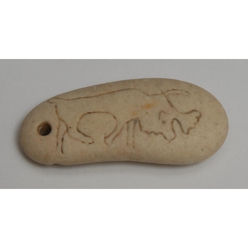 827 - Antiquities - a double-sided stone Scythian animal amulet, depicting an elk and a lion, 4.5cm wide, ... 