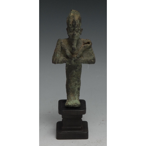 842 - Antiquities - an Ancient Egyptian bronze figure, of Osiris, he stands, holding implements, 11cm high... 