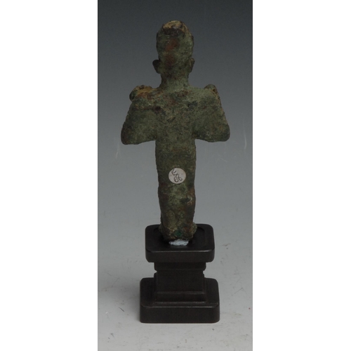 842 - Antiquities - an Ancient Egyptian bronze figure, of Osiris, he stands, holding implements, 11cm high... 