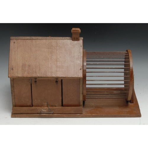 325 - A French softwood architectural rodent cage, as a house with wheel beside, sliding tray to base, 36.... 