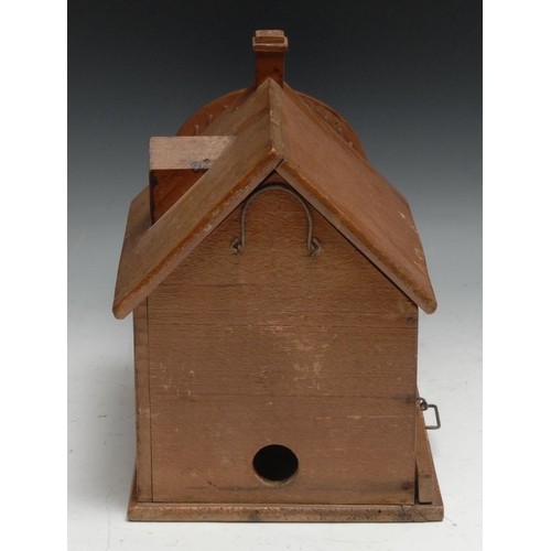 325 - A French softwood architectural rodent cage, as a house with wheel beside, sliding tray to base, 36.... 