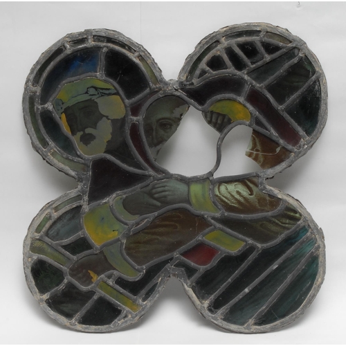 112 - A 19th century leaded stained glass quatrefoil window panel, decorated with figural subjects, 44cm w... 