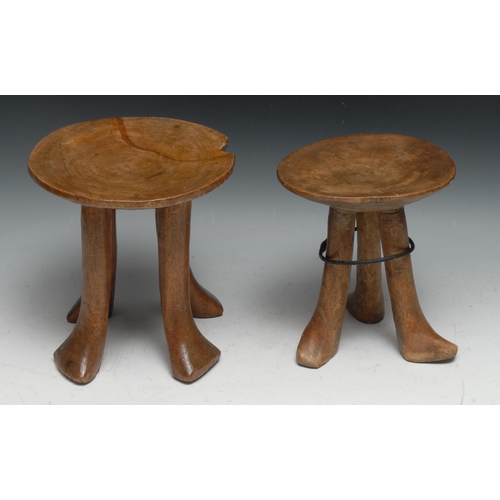 732 - Tribal Art - an Ethiopian carved tripod stool, 18.5cm high; another similar, 20cm high (2)