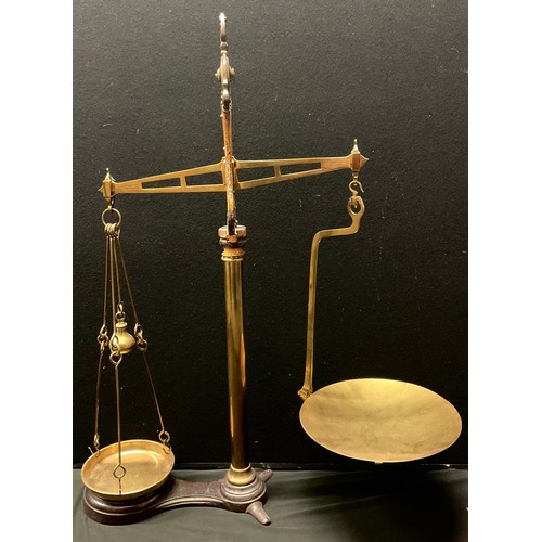 460 - A set of Victorian brass and cast iron shop balance scales, 'To Weigh 7LB', W & T Avery, Birmingham,... 